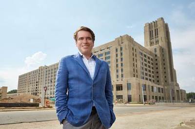 nexair CEO Kevin McEniry stands in front of Crosstown Concourse, the historic former Sears & Roebuck building in downtown Memphis, which will become nexair's new headquarters in 2017. nexair will occupy 33,000 square feet of the 1.1 million square foot mixed-use building, which was vacant for 20 years before a $200 million renovation project gave it new life. 