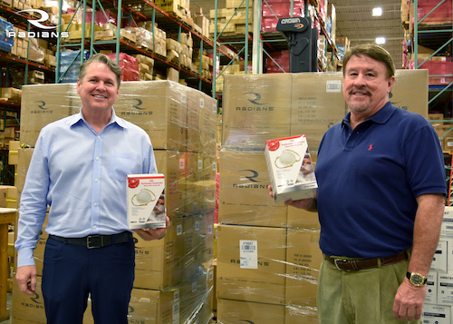 Radians president Bill England (left) and CEO Mike Tudor (right) pose with the company's donation of 14,000 N95 masks to help Memphis' first responders and health care front-line professionals combat COVID-19.