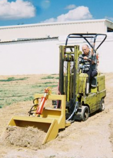 Jim Potts' "The Scoop" detachable scoop fits most forklifts and tractors and is available in three sizes. 