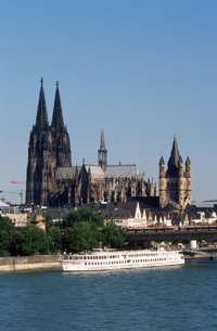 Just across the Rhine from the Cologne Convention Center beckons the old town district of Cologne, anchored by the city's iconic thousand-year-old cathedral. Cologne is one of the top cultural and shopping destinations in Europe. In addition to countless land-based hotels, the ship in the foreground of this photo is a floating hotel, a number of which ply the Rhine serving tourists and trade show attendees.  