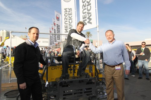 Lee Hadenfeldt, winner of Wacker Neuson’s 2010 TROWEL CHALLENGETM competition at the World of Concrete, celebrates his victory on his new customized CRT 48-35VX ride-on trowel powered by a special VanguardTM BIG BLOCKTM V-twin engine.  Celebrating with Hadenfeldt is Dan Roche (left), marketing manager-commercial power at Briggs & Stratton, and Johannes Schulze Vohren, vice president of sale and product support for Wacker Neuson Corporation