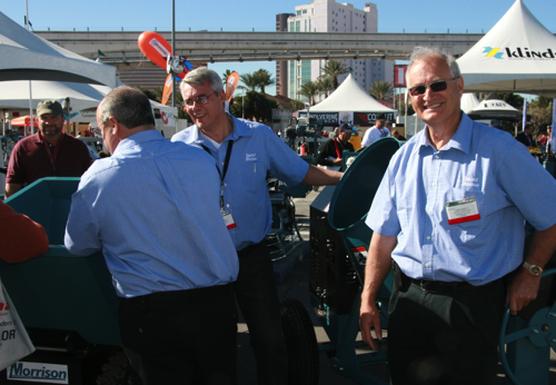 L-R: Jeff Durgin, John Locke and  Tom Foskett explain BMI equipment  benefits to contractor customers at  the 2011 World of Concrete show. 