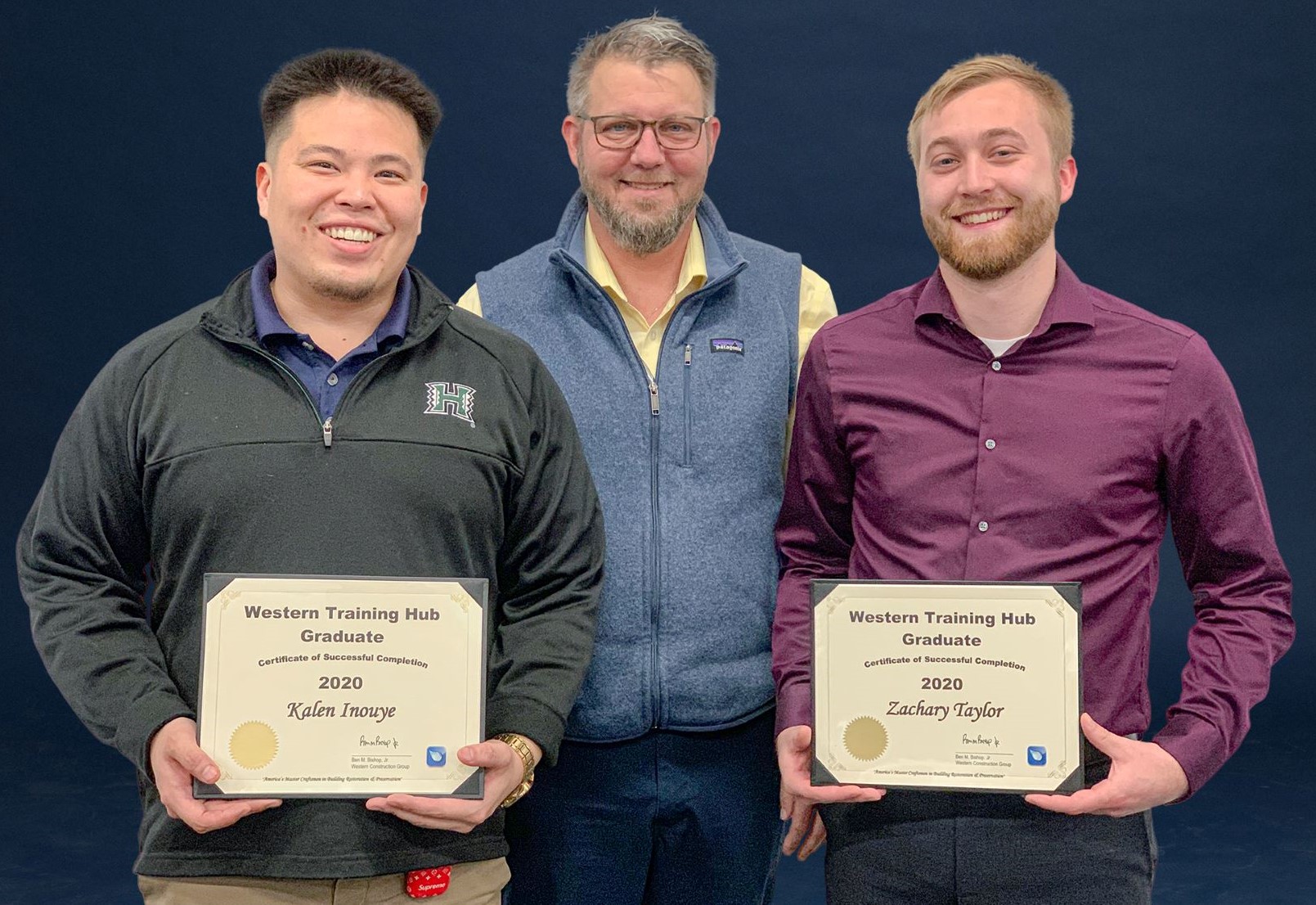 Graduates of Western Specialty Contractors’ Training Hub Program pose with their certificates of completion with Western COO Tom Brooks (center).