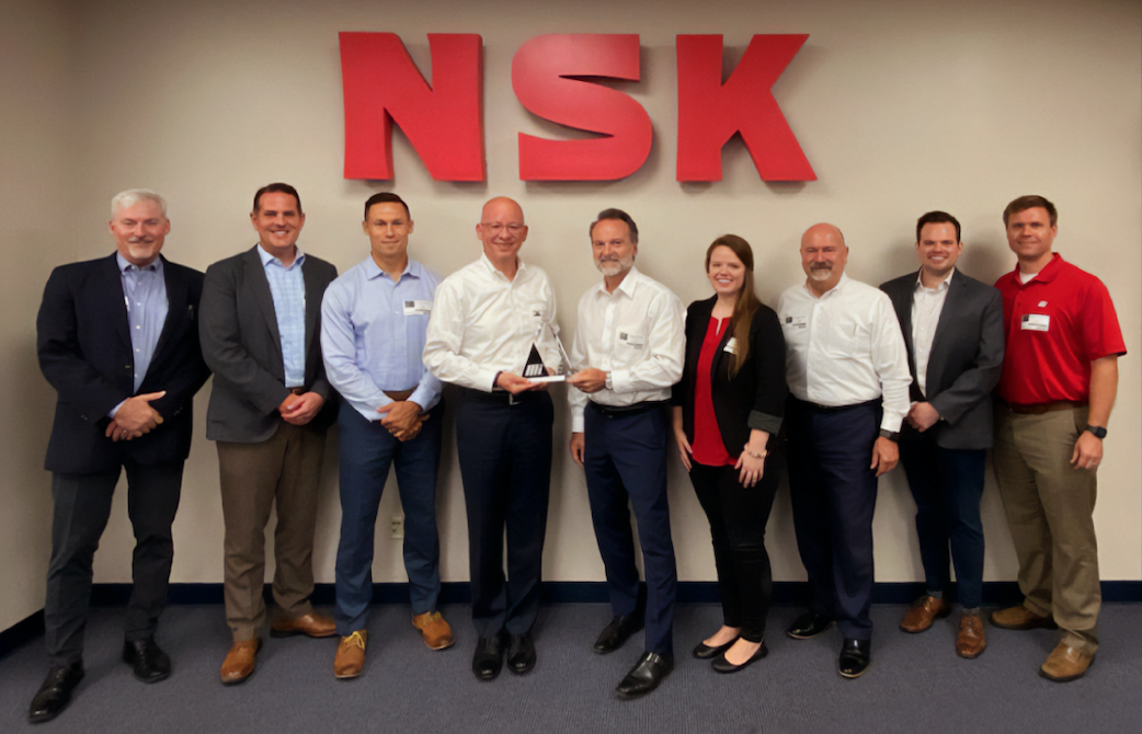 Motion and NSK officers at the award presentation, L-R: David Tassi and Andrew Pelletier (NSK); Chris Brewer (Motion); Tarek Bugaighis (NSK); Joe Limbaugh, Julie Knight and Robert Anaforian (Motion); Taylor Bond (NSK); and Alan Cripps (Motion).