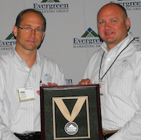 Paul (L) and Steve Kuhlman accept the Evergreen Marketing Group's Distributor of the Year Tier 1 award on behalf of their company, Acme Tools of Grand Forks, ND