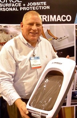 Trimaco vice president Charlie Reaves shows off the company’s brand new Easy Floor Guard, a simple and economical “instant shoe cover” for job site interior work.