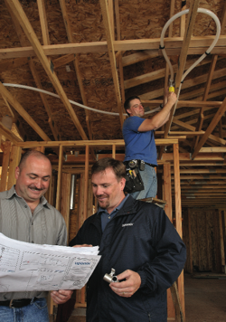Plumbing contractor Steve Svedarsky (left) credits Uponor rep Kelly Fahey (right) with helping him to complete 20 fire sprinkler jobs and to secure an  additional 30 multi-family units — all in less than four months in 2007.