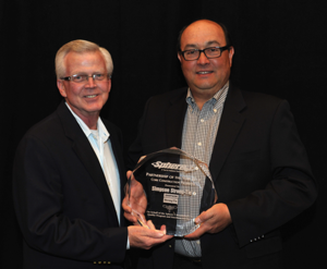 Kent Gilbert (L) and Mike Clemente (R) accept the Sphere 1 Preferred Supplier Partner of the Year award on behalf of Simpson Strong-Tie.