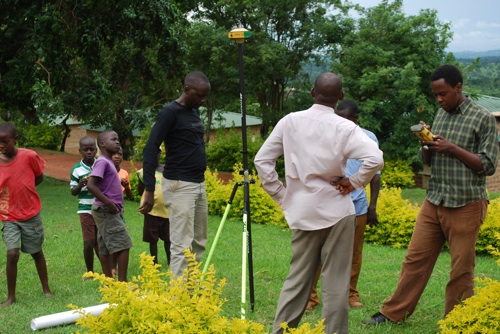A Watoto engineering and construction crew localizes control points using a HiPer GA GPS+ receiver and FC-250 data collector equipped with Pocket 3D software.